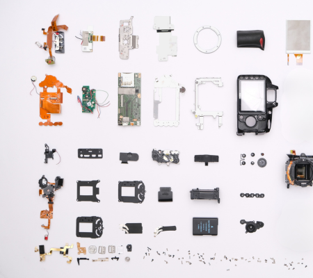 Icons in bubbles leading out from person in centre showing cogs, magnifying glass and basket 